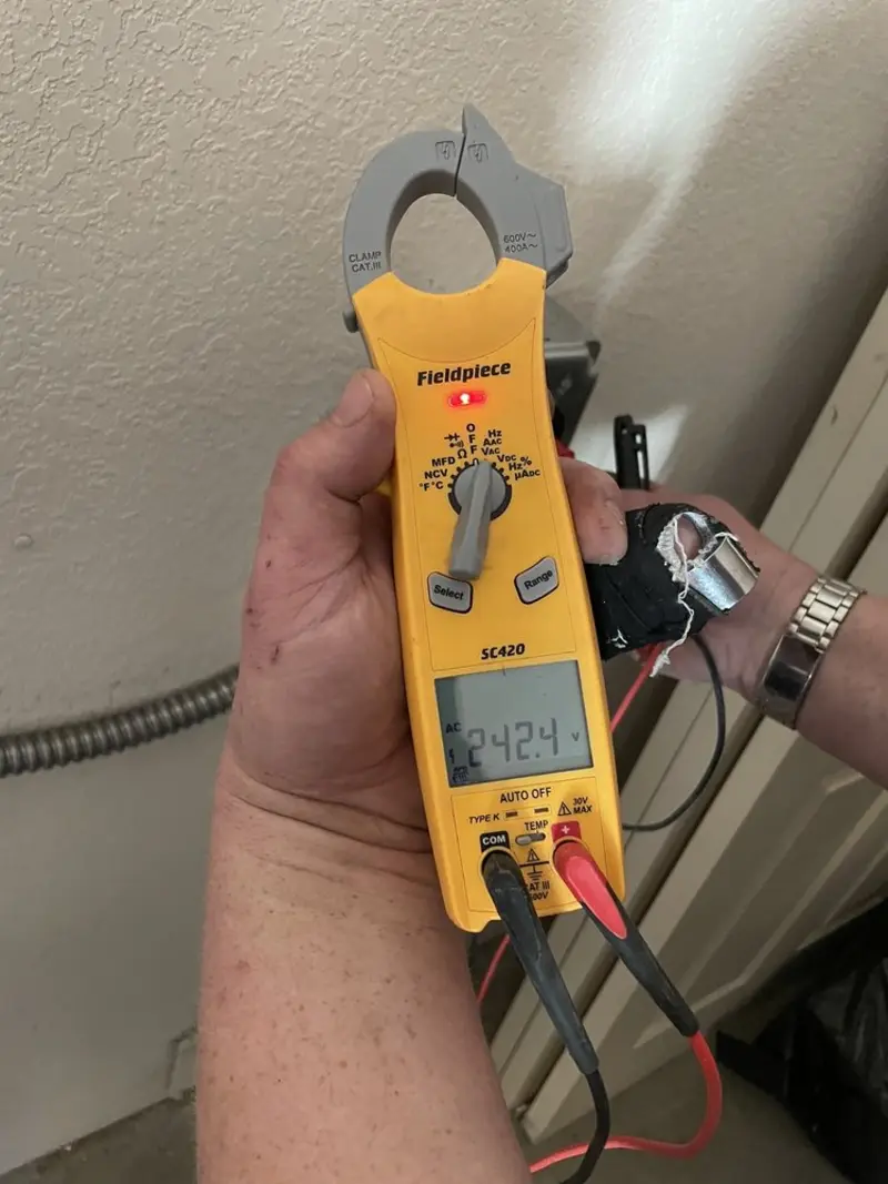 Voltage testing with clamp meter during Whole House Surge Protector in Montgomery
